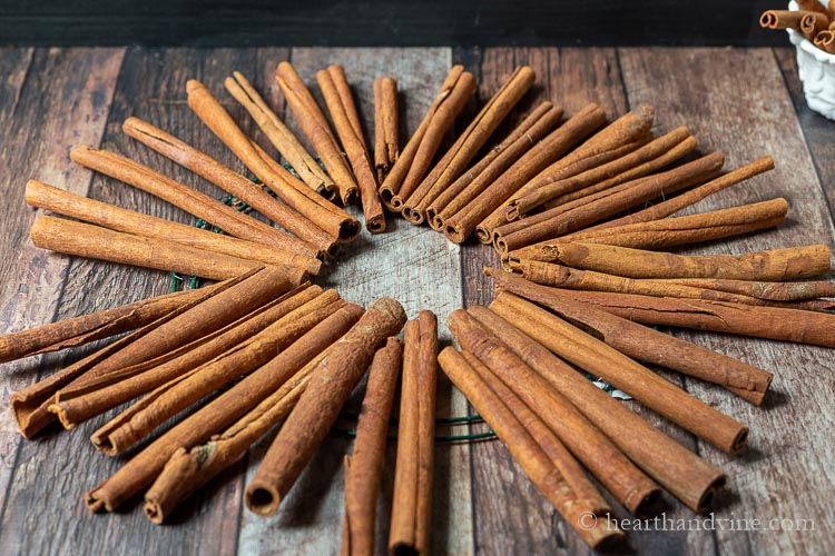Cinnamon sticks glued around a wire round frame.