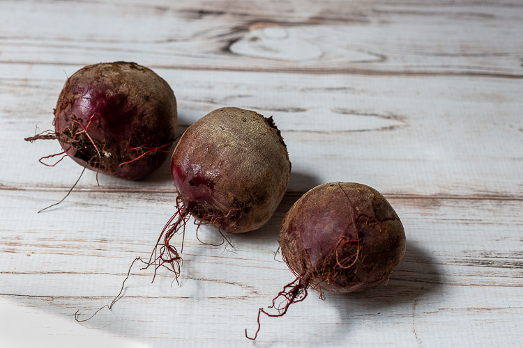 Three large garden fresh raw beets.