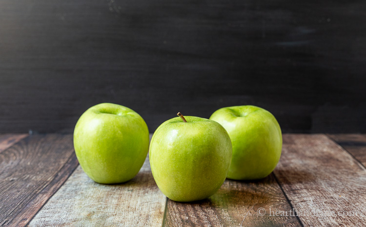 Three granny smith apples.