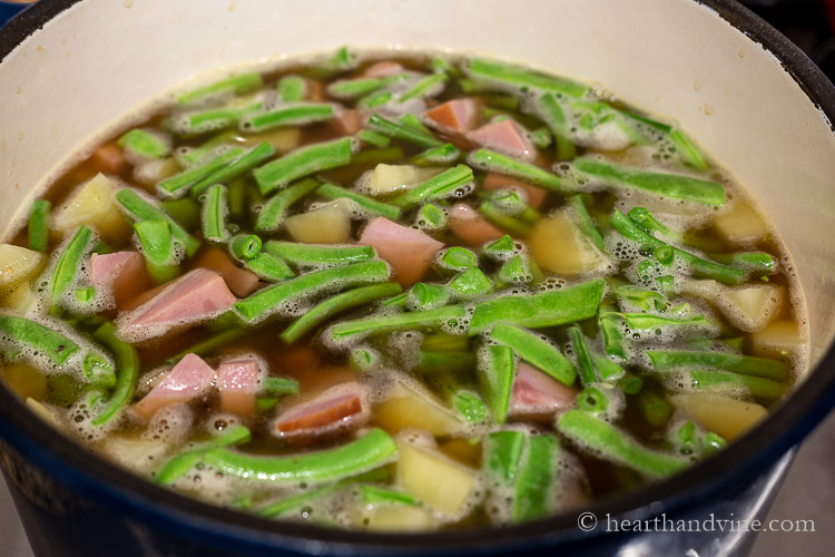 Ham and string bean soup simmering on the stove.