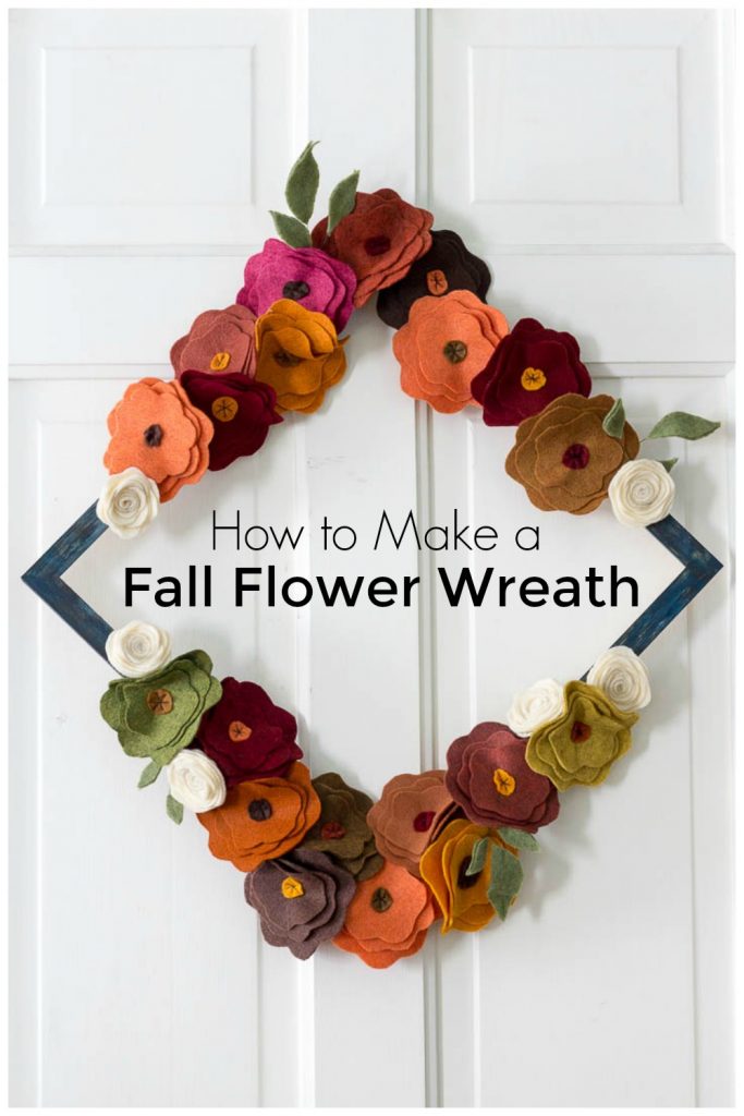 Fall felt flower wreath on a white door with text overlay. "How to make a fall flower wreath."