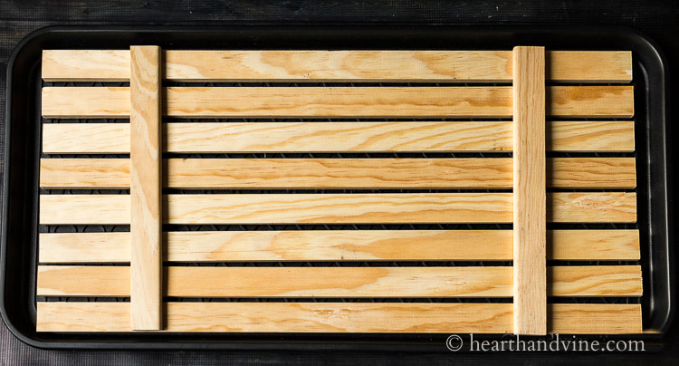 https://hearthandvine.com/wp-content/uploads/2020/09/plastic-boot-tray-wooden-slat-pattern.jpg