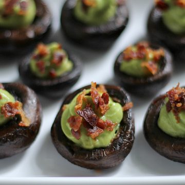 mushrooms stuffed with avocado cream and topped with bacon bits