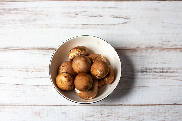 Bowl of baby bella mushrooms.