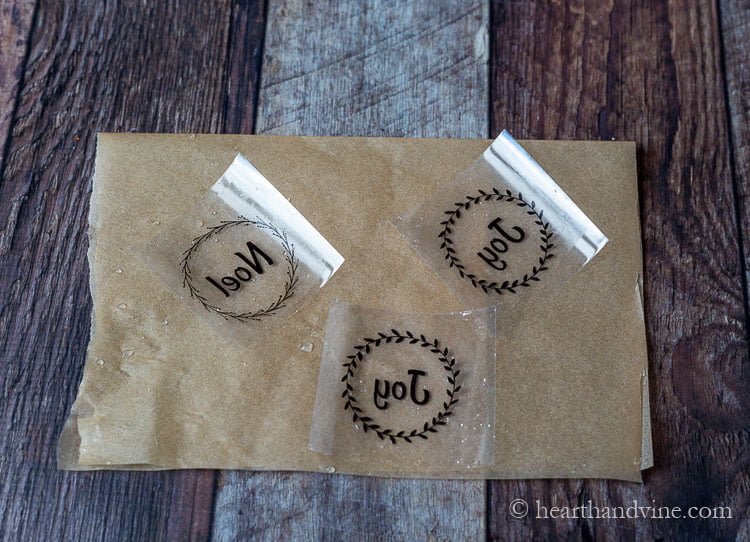 Packing tape labels drying on parchment paper.