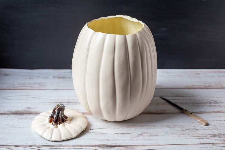 Resin white pumpkin with top cut out.
