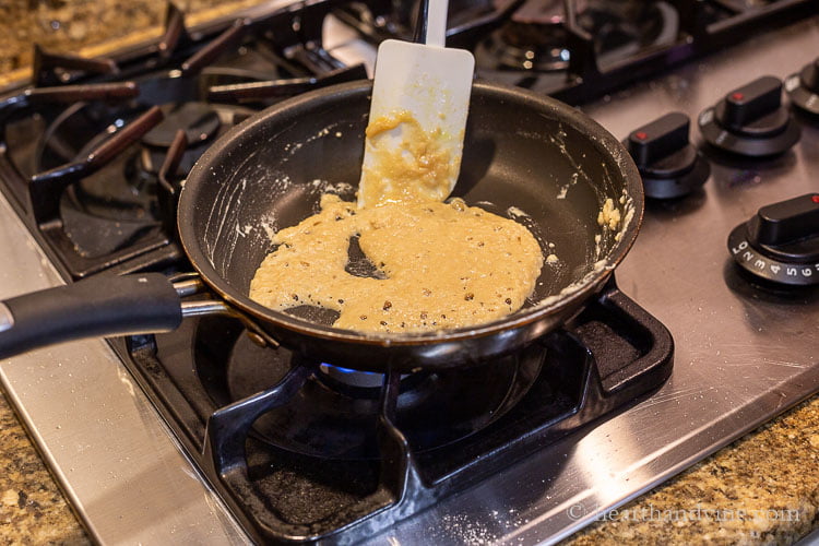 Making a roux from roast fat and flour in a small frying pan.