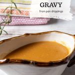 Gravy boat with pan dripping gravy.