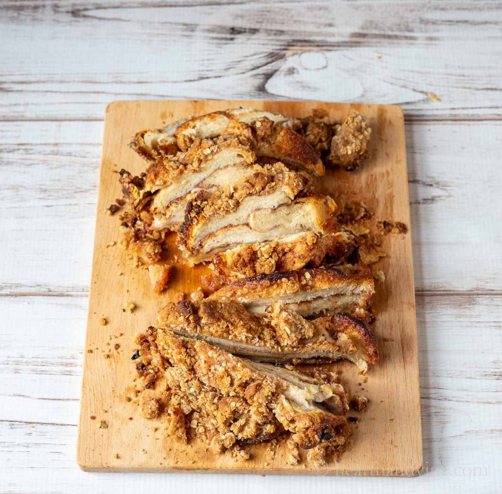Cinnamon toast crunch bread sliced on a cutting board.
