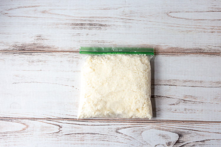 Bag of crumbled queso fresco cheese.
