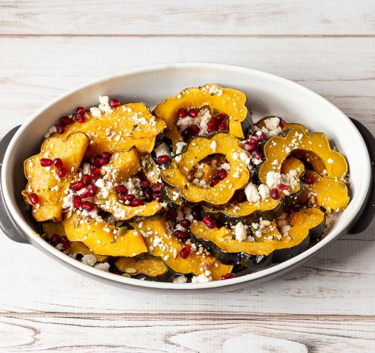 Roasted Acorn Squash with Pine Nuts, Pepitos, Pomegranate and Queso