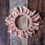 Red and white striped rag wreath ornament.