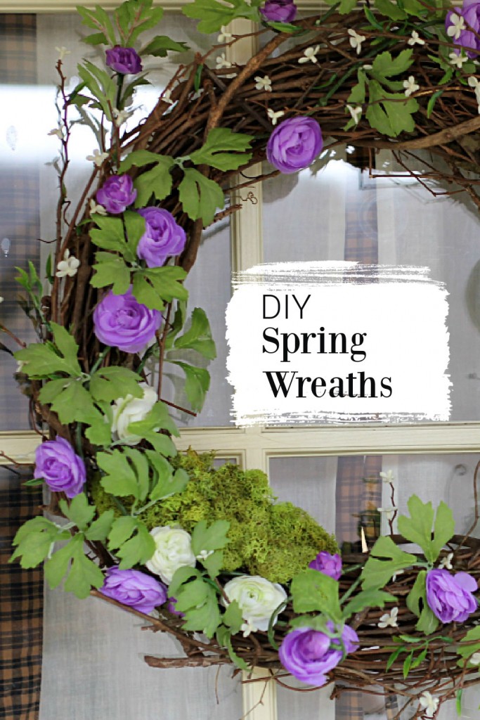 Spring wreath made with a grapevine base, a garland of purple and cream flowers and some moss.