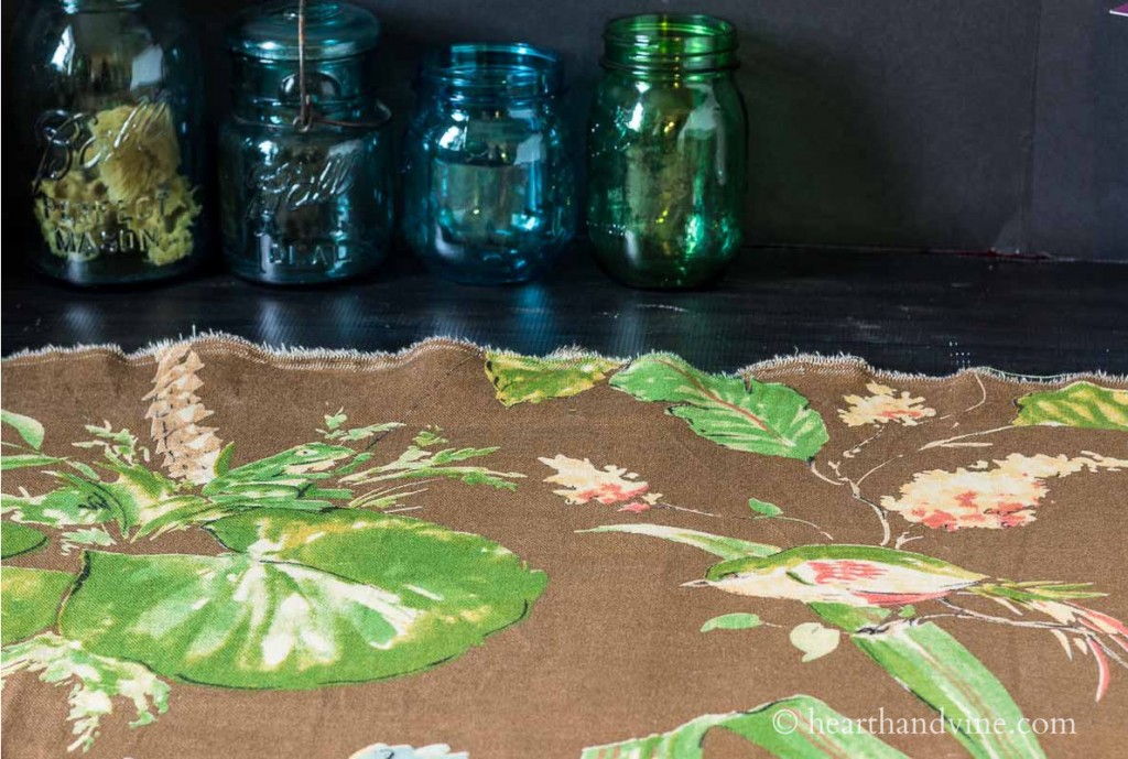 Pretty printed floral, frog and bird fabric.