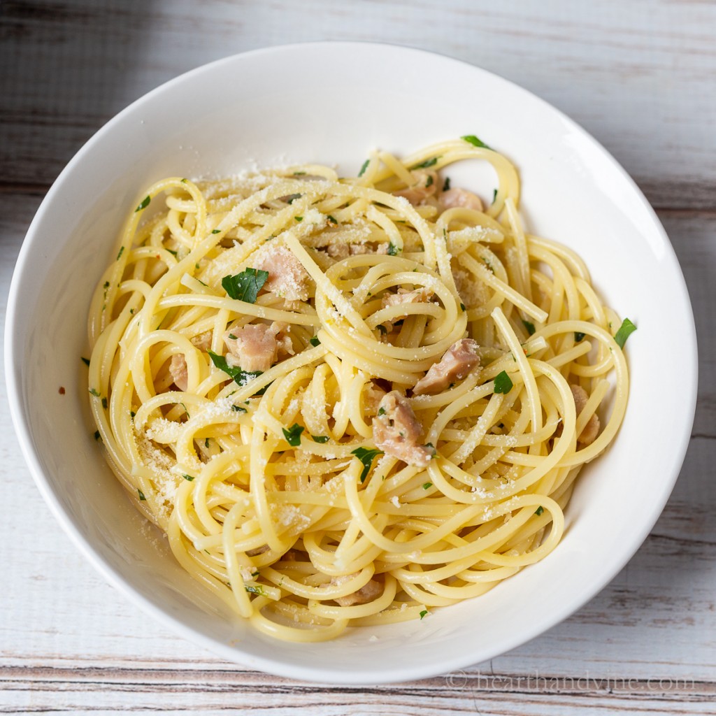 A bowl of spaghetti with clam sauce.