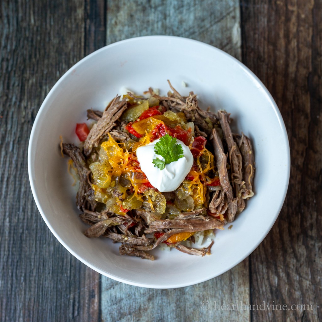 Bowl of slow cooker Mexican beef over cauliflower rice.