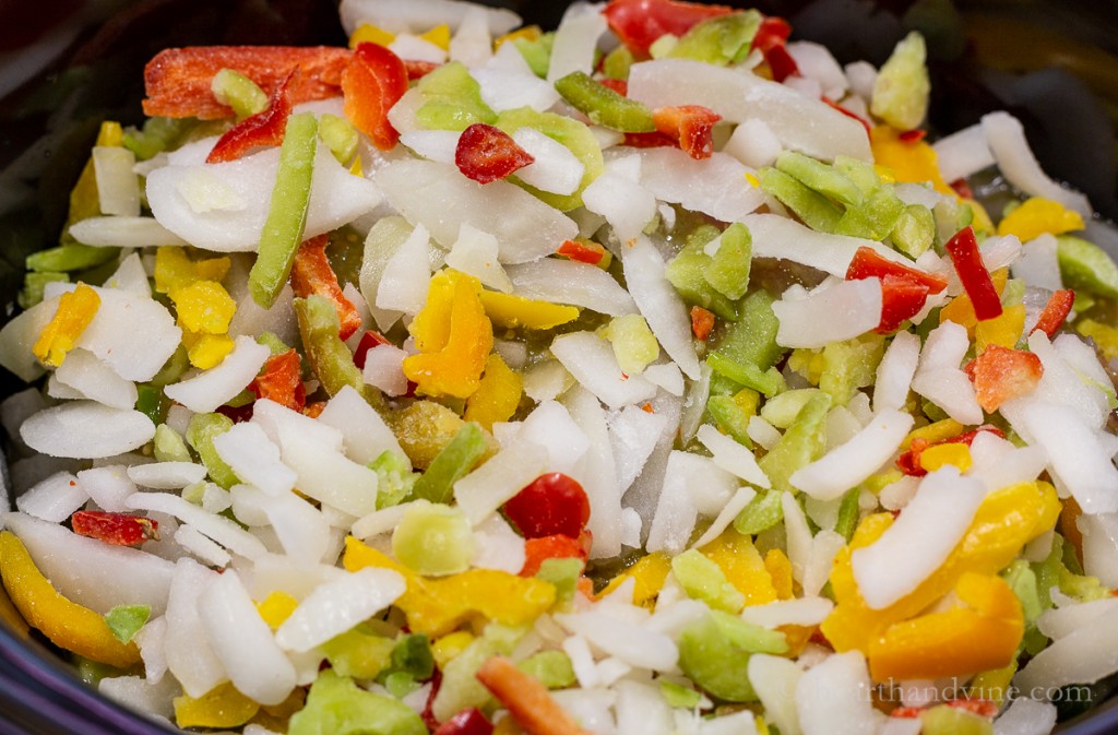 Frozen onions, red, yellow and green peppers cut up.