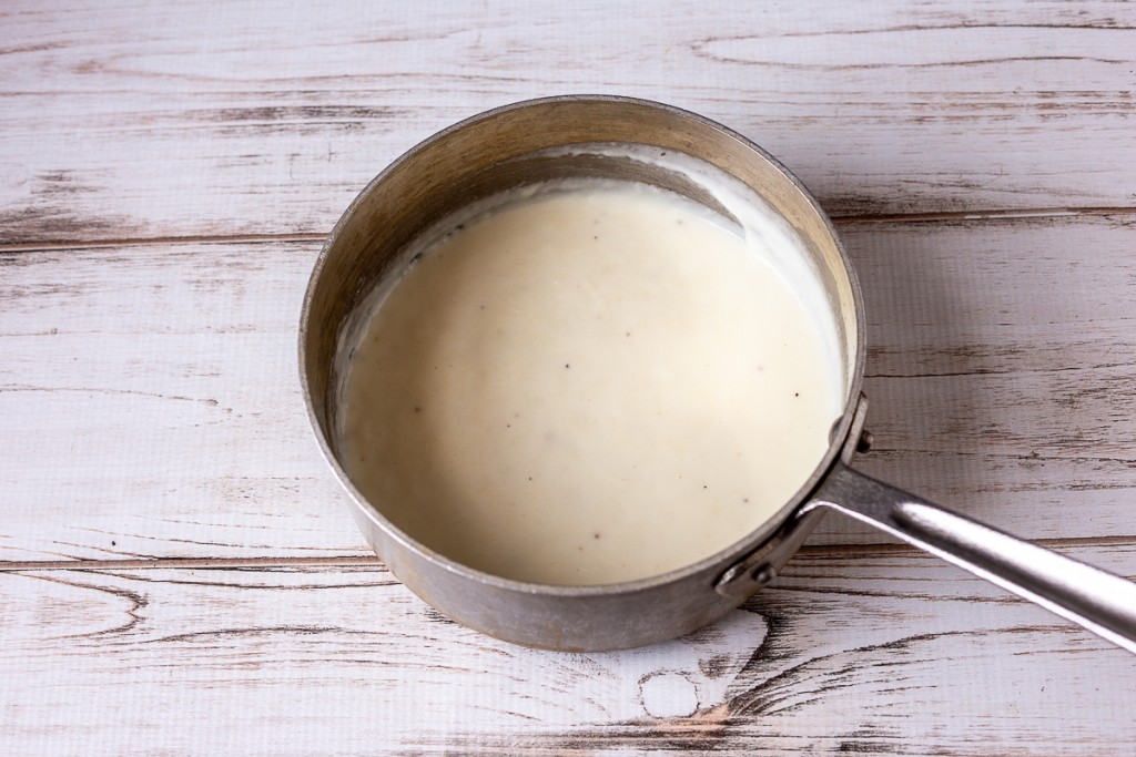White cream sauce in a sauce pan.
