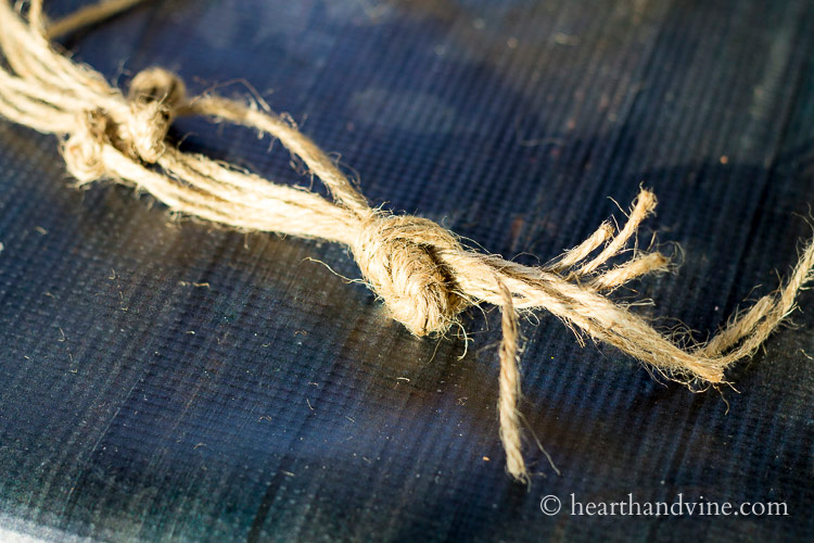 Eight pieces of twine tied together at the bottom in one overhand knot.