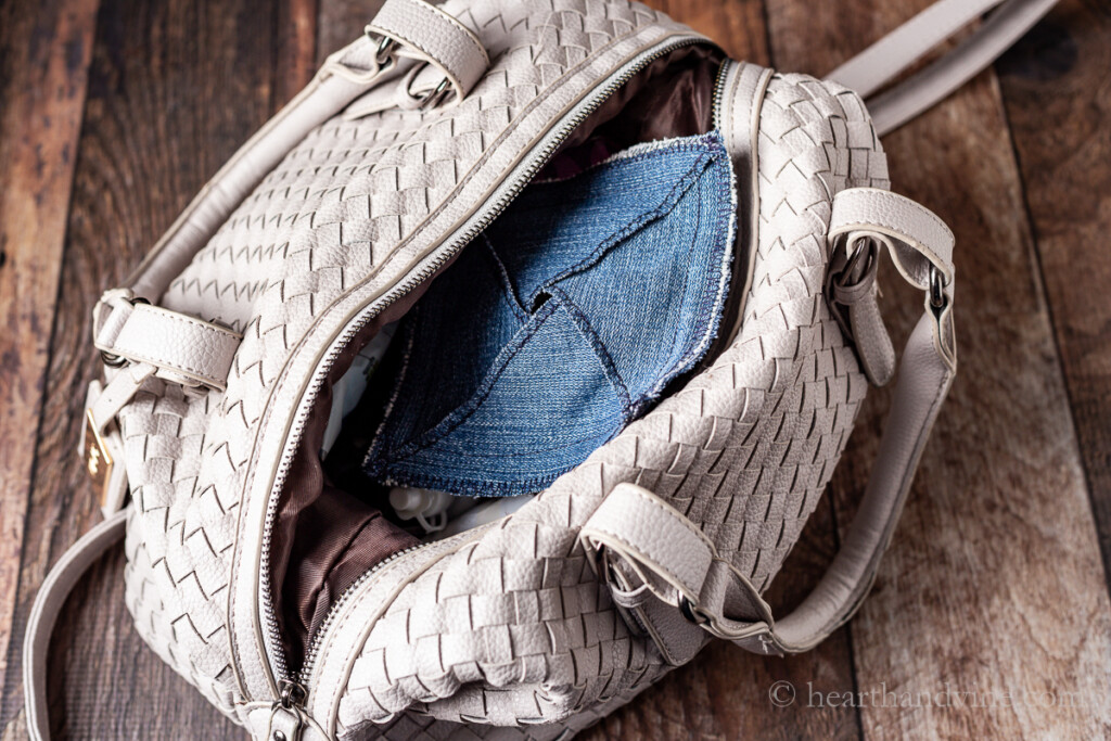 Handmade denim pouch inside a handbag.