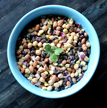 3 bean party dip in a blue bowl