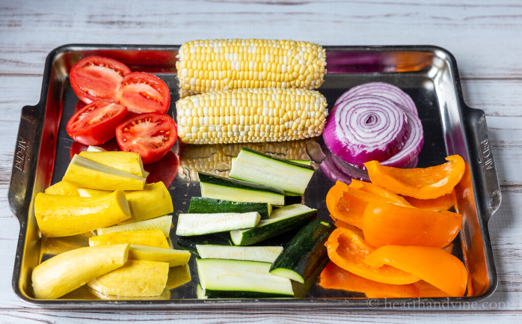 Vegetables on a large jelly roll pan.