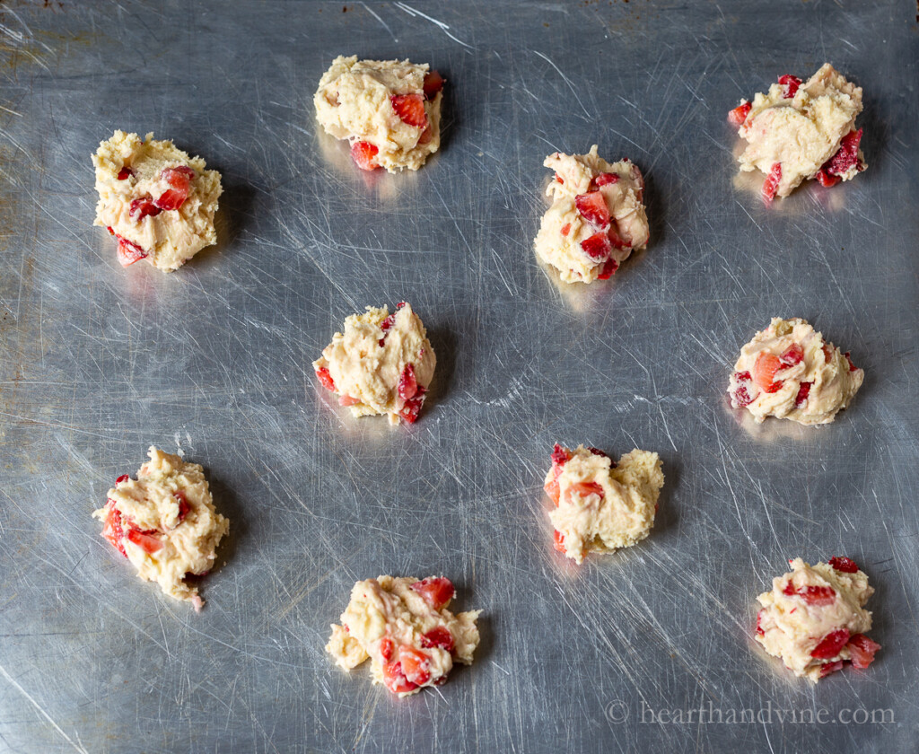 Strawberry cookie dough on a baking sheet.
