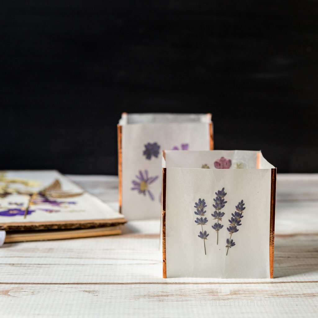 Pressed flower luminaria with lavender flowers.