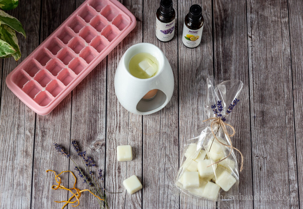 Dried lavender and lemon peel, essential oils, silicone ice cube tray, wax burner and bag of wax melt cubes.