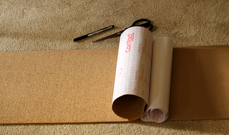 Cork shelf liner paper with some of the backing removed.