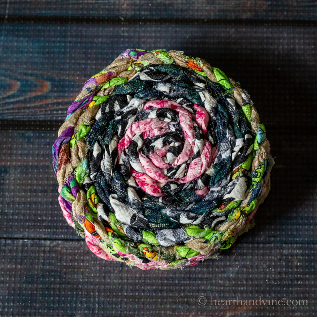 A stack of multi-colored fabric twine.