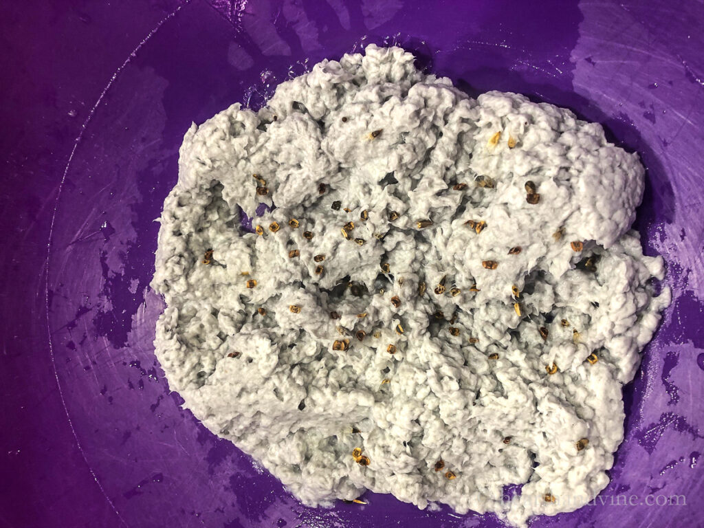 Paper pulp with wildflower seeds on top.