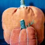 Two primitive handmade pumpkins