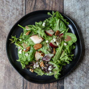 Pear and blue cheese salad with pecans and plum dressing