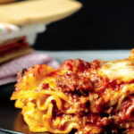 Side view of a slice of lasagna.