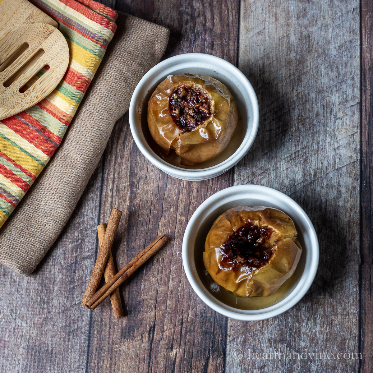 Two ramekins with baked apples.