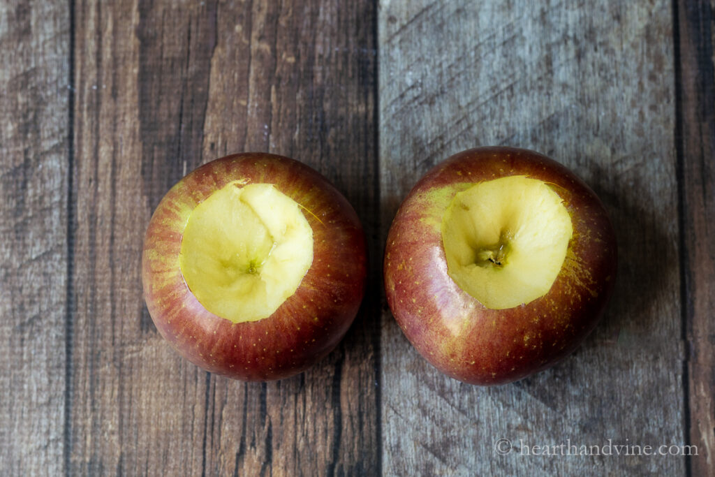 Two apples with the center section cut out.