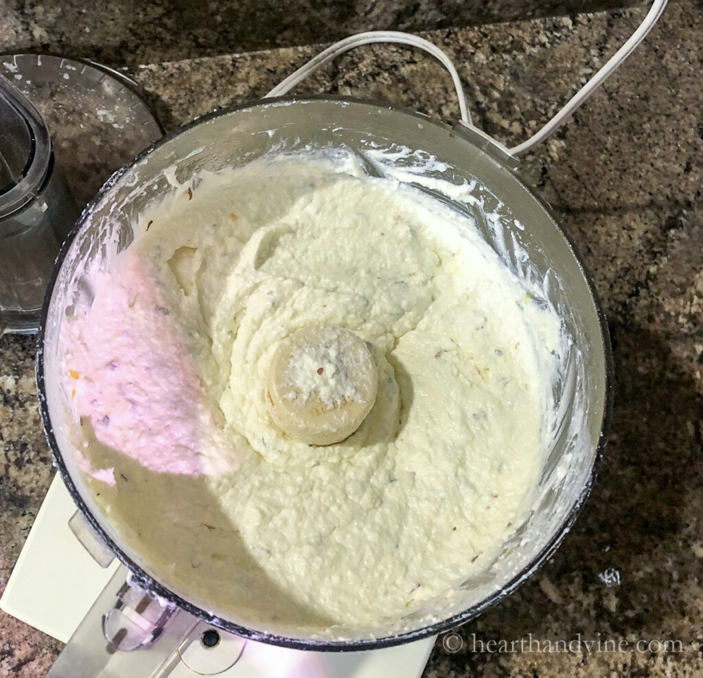 Feta cheese, cream cheese and seasoning in a food processor.