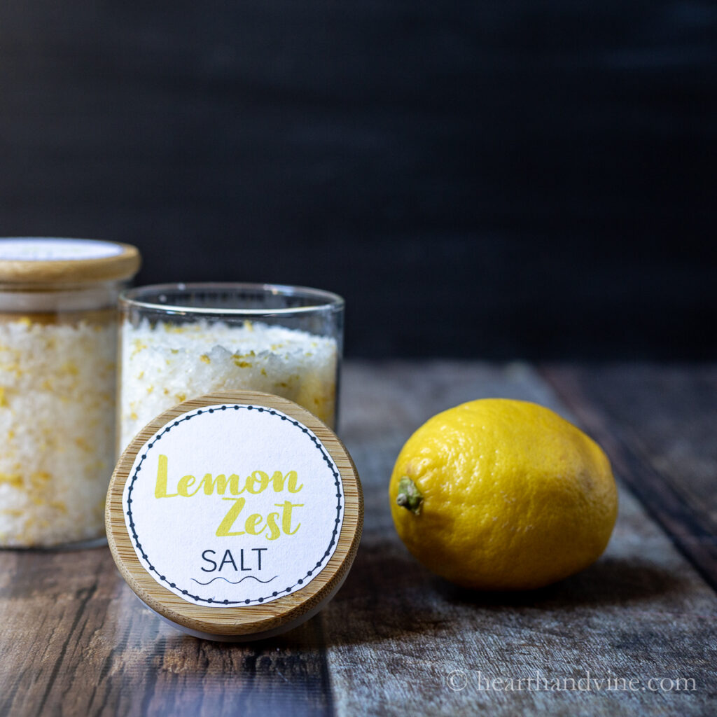 Jars of lemon zest salt an a lemon.