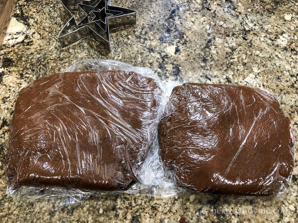 Applesauce cinnamon dough in two discs wrapped in plastic.