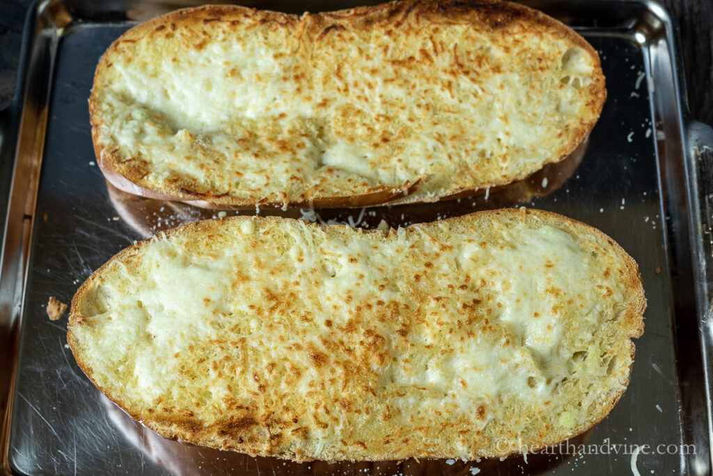 Broiled homemade garlic bread with cheese.