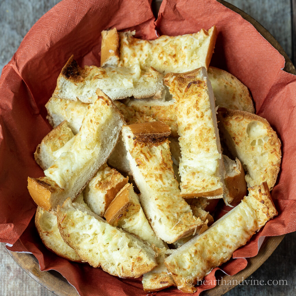 Basket of sliced cheesy garlic bread.