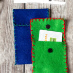 Two felt bags. One blue and one green.