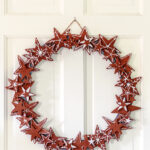 Cinnamon applesauce wreath on a white door.