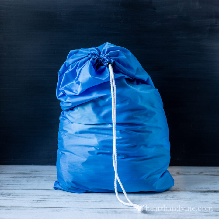 Blue nylon drawstring laundry bag.