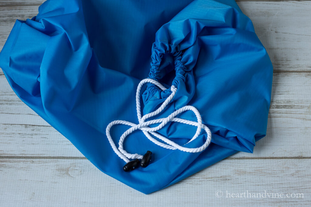 DIY laundry bag with white drawstring and toggle locks on the ends.