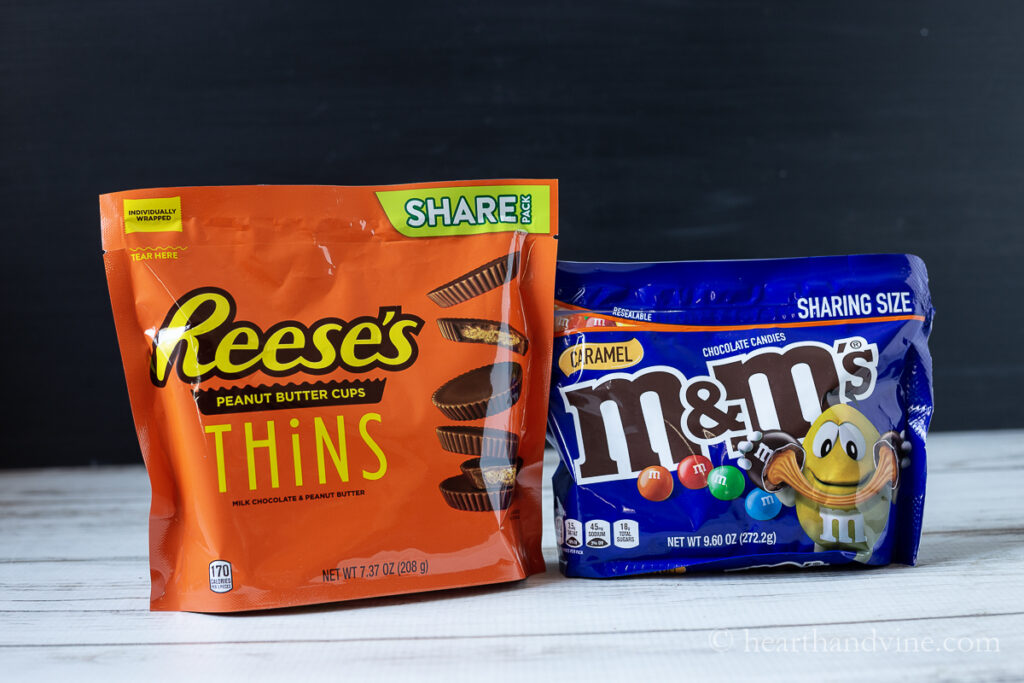 Bag of Reese's thinnns and M&M caramel candies.