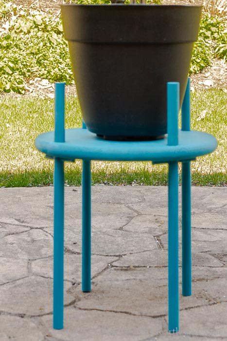 Painted blue wood plant table with large pot.