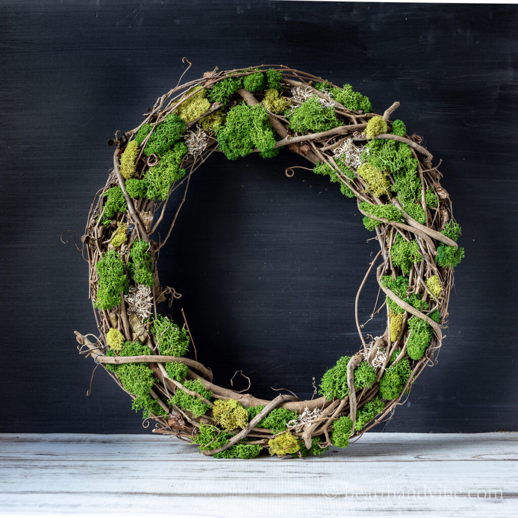 Grapevine wreath with moss.
