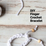 White finger crochet bracelet and wood beads.
